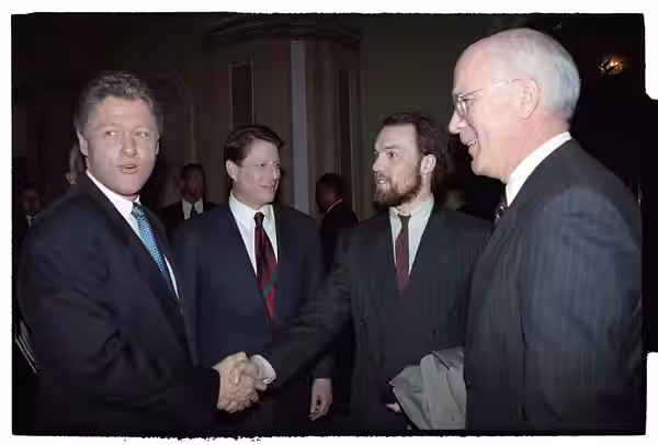 Photographs of former-President George HW Bush departing the U.S. Capitol and President William Jefferson Clinton greeting guests at the Inaugural Luncheon in t