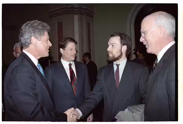 Photographs of former-President George HW Bush departing the U.S. Capitol and President William Jefferson Clinton greeting guests at the Inaugural Luncheon in t