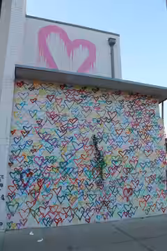 Street Artist Mr. Brainwash 2016 International Women's Day Murals Installation at Union Market on the 1300 block of 6th Street, NE, Washington DC on Friday afte