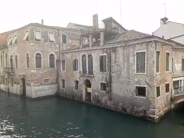 “Migrant Child” stencil by Banksy was painted on a wall in Venice in 2019; this photograph was taken three years later when it was somewhat degraded – including (2022)