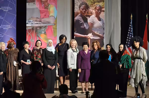 Honorees of the 2011 International Women of Courage Award with Secretary of State Hillary Clinton, Michelle Obama, and Judith Hill. (Photo by Roshan Nebhrajani/