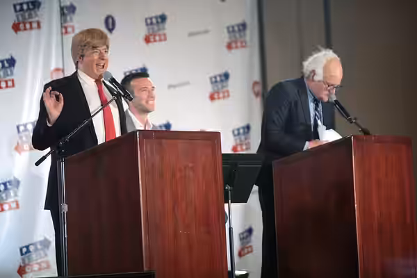 Anthony Atamanuik as Donald Trump, Jon Favreau and James Adomian as Bernie Sanders speaking at the 2016 Politicon at the Pasadena Convention Center in Pasadena,