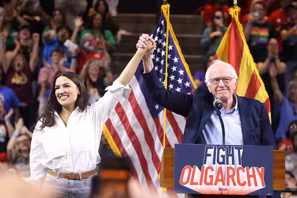 U.S. Congresswoman Alexandria Ocasio-Cortez and U.S. Senator Bernie Sanders speaking with attendees at a "Fight Oligarchy" rally at Mullett Arena in Tempe, Ariz (2025)