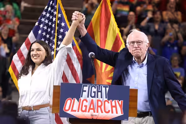 U.S. Congresswoman Alexandria Ocasio-Cortez and U.S. Senator Bernie Sanders speaking with attendees at a "Fight Oligarchy" rally at Mullett Arena in Tempe, Ariz (2025)