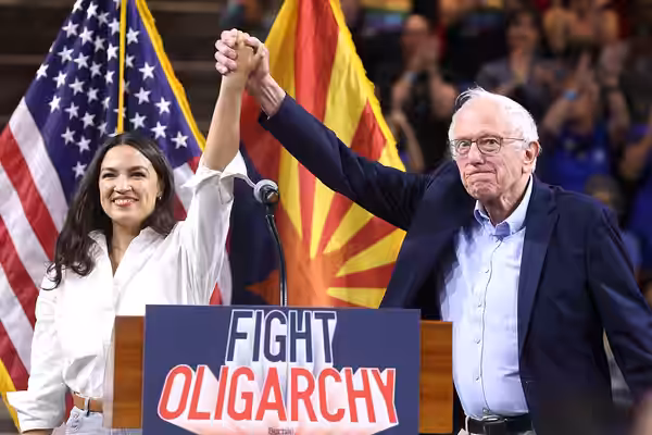 U.S. Congresswoman Alexandria Ocasio-Cortez and U.S. Senator Bernie Sanders speaking with attendees at a "Fight Oligarchy" rally at Mullett Arena in Tempe, Ariz (2025)