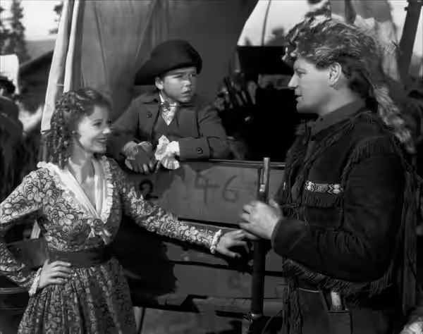 L. to R. : Heather Angel, Dick Jones &amp; Ralph Forbes in Daniel Boone - cropped screenshot (1936)