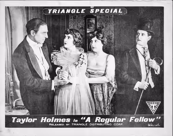 Lobby card for the American film A Regular Fellow (1919). The card has been auto corrected with minor flaws fixed.