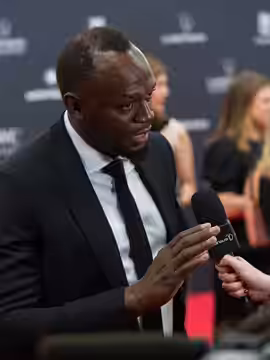 Usain Bolt, the sprinting icon, engages with the official broadcaster during the 25th Laureus World Sports Awards. (2024)