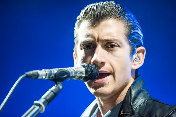 Alex Turner performing with Arctic Monkeys at Roskilde Festival 2014 on Orange Stage