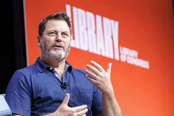 Nick Offerman discusses his recent book, "Where the Deer and the Antelope Play," with Millie Jimenez of the National Park Service at the 2022 National Book Fest