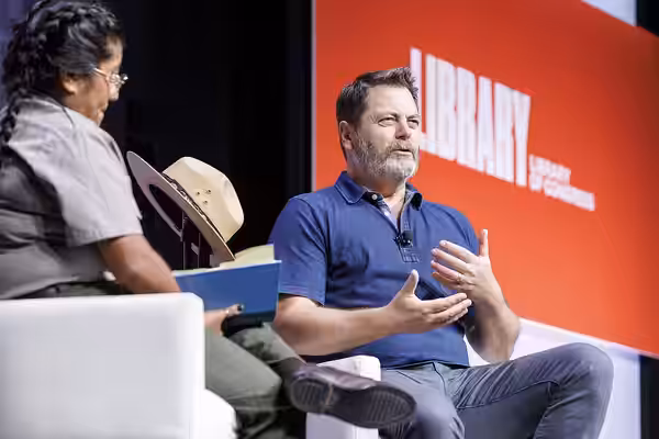 Nick Offerman discusses his recent book, "Where the Deer and the Antelope Play," with Millie Jimenez of the National Park Service at the 2022 National Book Fest