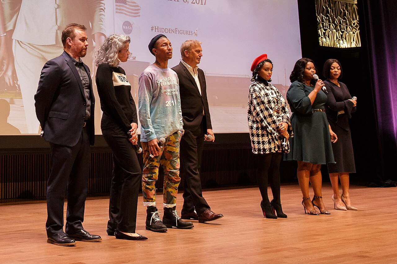 From left: director Theodore Melfi, producer Mimi Valdés, American singer-songwriter Pharrell Williams, American actor, film director, and producer Kevin Costne
