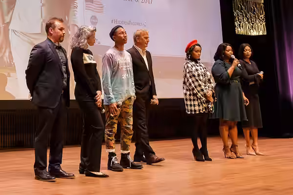 From left: director Theodore Melfi, producer Mimi Valdés, American singer-songwriter Pharrell Williams, American actor, film director, and producer Kevin Costne