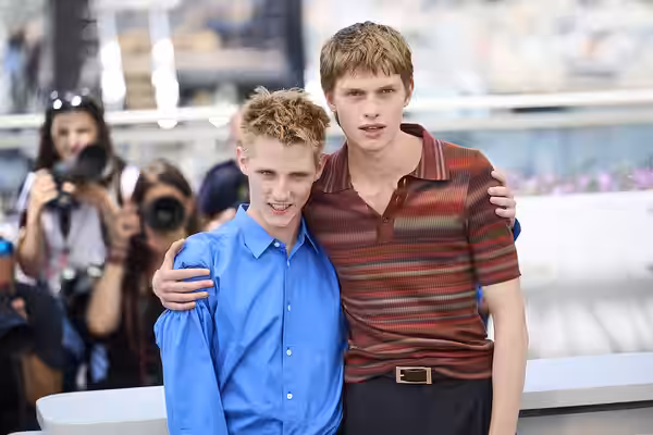 EMMANUEL MACCHIA and VALENTIN CAMPAGNE pose together during a photocall for the film "Coward" at the 2026 Cannes Film Festival