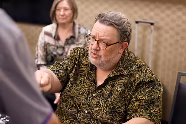 Roger L. Jackson speaking with attendees at the 2025 Amazing Art Expo at the Renaissance Phoenix Downtown Hotel in Phoenix, Arizona. Please attribute to Gage Sk