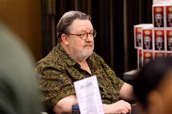 Roger L. Jackson speaking with attendees at the 2025 Amazing Art Expo at the Renaissance Phoenix Downtown Hotel in Phoenix, Arizona. Please attribute to Gage Sk