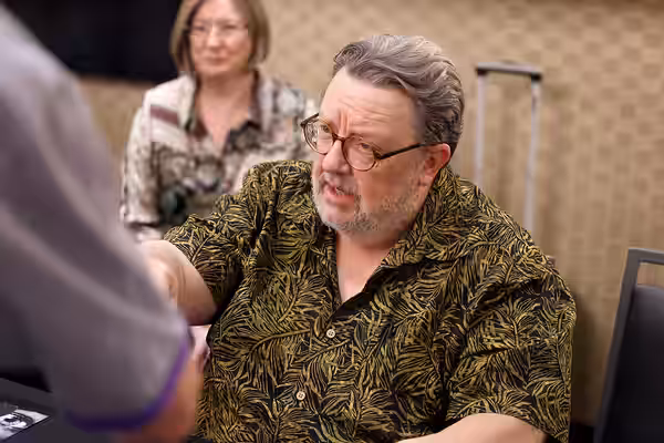 Roger L. Jackson speaking with attendees at the 2025 Amazing Art Expo at the Renaissance Phoenix Downtown Hotel in Phoenix, Arizona. Please attribute to Gage Sk