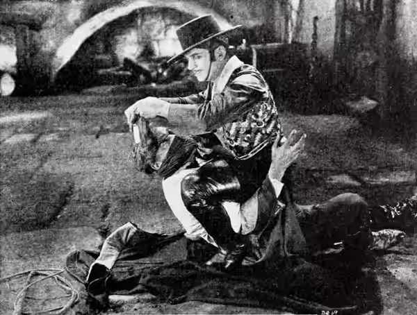 Still from the American romantic adventure film Don Q, Son of Zorro (1925) with Douglas Fairbanks and Donald Crisp, on page 81 of the May 16, 1925 Exhibitors He
