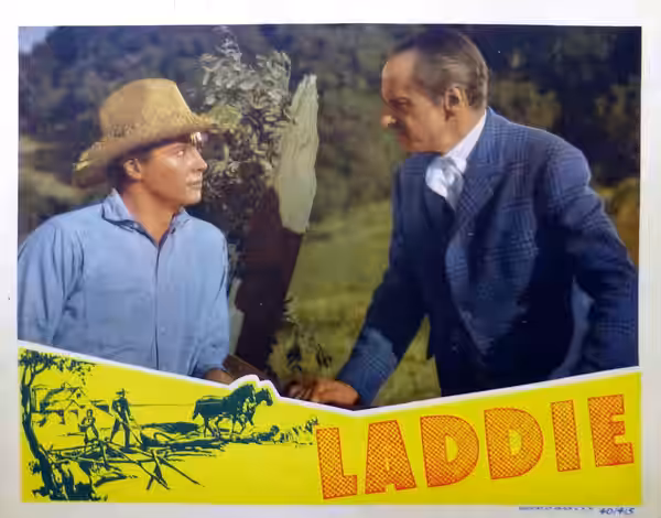 Lobby card for the American drama film Laddie (1940). Laddie (Tim Holt) and Mr. Pryor (Miles Mander).