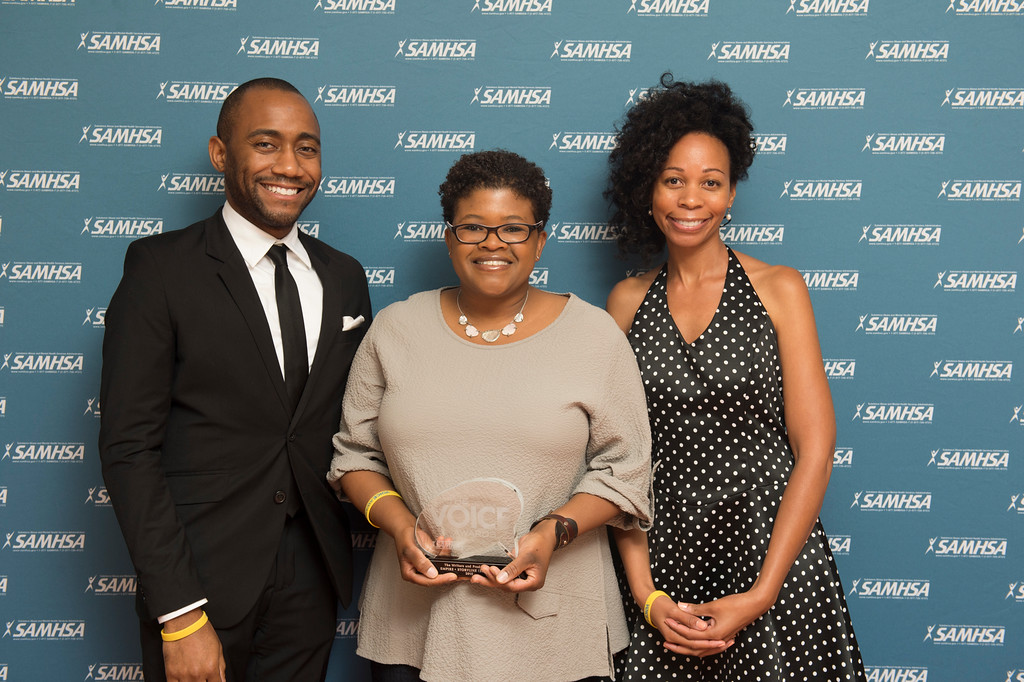 Joshua Allen and Attica Locke, writers and producers of the show Empire, stand with their 2015 Voice Award. They are joined by Sonay Washington Hoffman from Wri