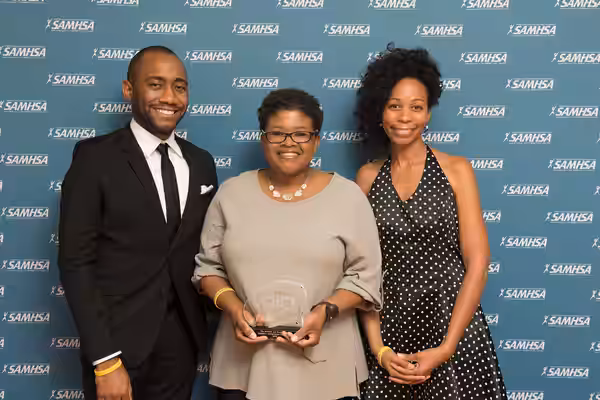 Joshua Allen and Attica Locke, writers and producers of the show Empire, stand with their 2015 Voice Award. They are joined by Sonay Washington Hoffman from Wri
