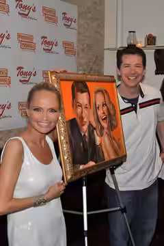 At the unveiling of a portrait of Kristen Chenoweth and Sean Hayes (who were starring in the Broadway revival of Promises, Promises) for Tony's di Napoli's Broa (2010)