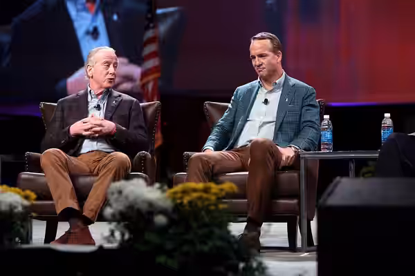 Archie and Peyton Manning speaking to attendees at the American Farm Bureau Federation's Annual Convention at the Phoenix Convention Center in Phoenix, Arizona.