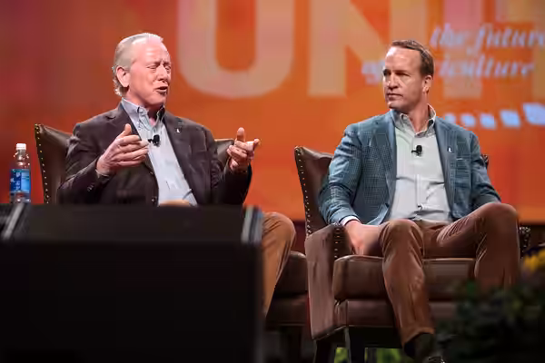 Archie and Peyton Manning speaking to attendees at the American Farm Bureau Federation's Annual Convention at the Phoenix Convention Center in Phoenix, Arizona.