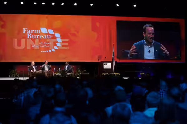Archie and Peyton Manning speaking to attendees at the American Farm Bureau Federation's Annual Convention at the Phoenix Convention Center in Phoenix, Arizona.