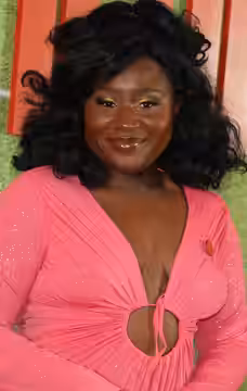 This is a picture of Susan Wokoma on the red carpet for the Netflix feature film, The Beautiful Game in 2024.