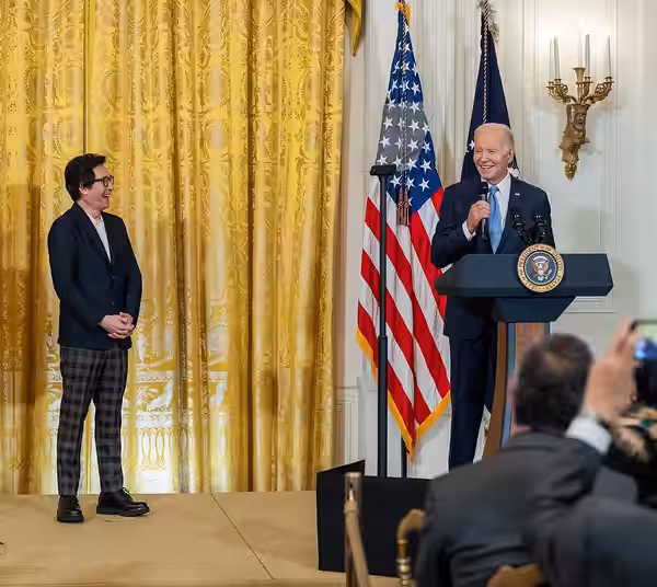Actor Ke Huy Quan with President Joe Biden, as Biden delivers remarks before a screening of the film “American Born Chinese,” Monday, May 8, 2023, in the East R