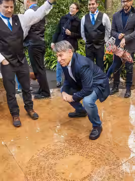 Composer Stephen Schwartz gathers with members of the San Francisco Gay Men's Chorus at the Artists Portal at the National AIDS Memorial Grove on World AIDS Day (2018)