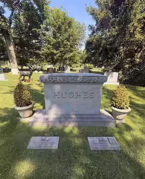 Grave of John Wilden Hughes Jr. (1950–2009) at Lake Forest Cemetery, Illinois (2026)
