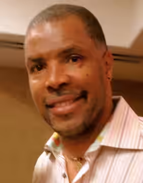 A "selfie" authored by Kristen Lamb, with the subjects en:Eriq La Salle and Kristen Lamb in the foreground, taken at Thrillerfest in NYC in 2012 and uploaded on
