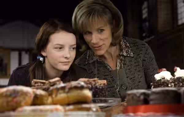 A publicity still from Dustbin Baby showing April (left, played by Dakota Blue Richards) and Marion (Juliet Stevenson)