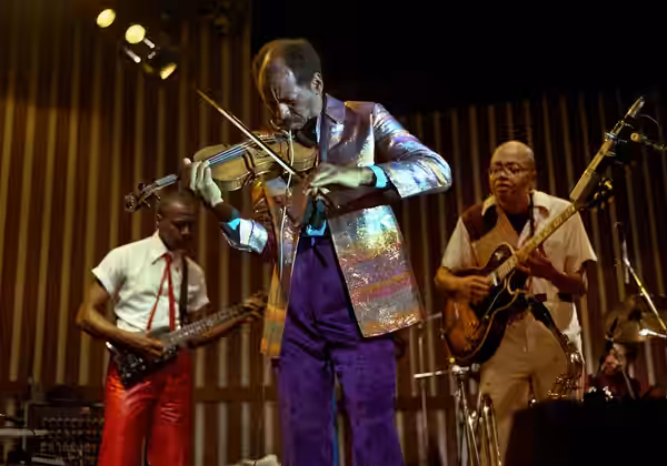 Ornette Coleman with Prime Time at the Caravan of Dreams (here with Charles Ellerbie, left, and Bern Nix, right) (1985)
