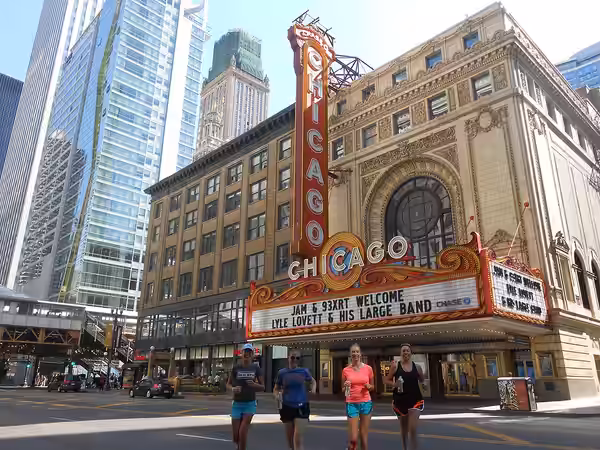 Running across State St. with Chicago's most famous marquee sign in the back ground. (2015)