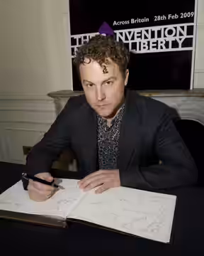 Sam West -London, England. He signs to pledge support to The Convention on Modern Liberty at the start of a campaign. The launch took place at The Foreign Press (2009)