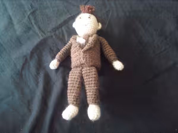 A gift from my wife (TheBon). Tiny crocheted David Tennant (Doctor Who) even sports a sonic screwdriver and psychic paper in his breast pocket. (2008)