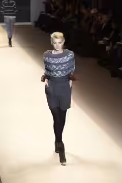 A model walks the runway at the ADAM Fall/Winter 2010 show at New York Fashion Week, February 2010.