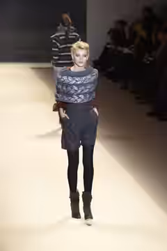 A model walks the runway at the ADAM Fall/Winter 2010 show at New York Fashion Week, February 2010.