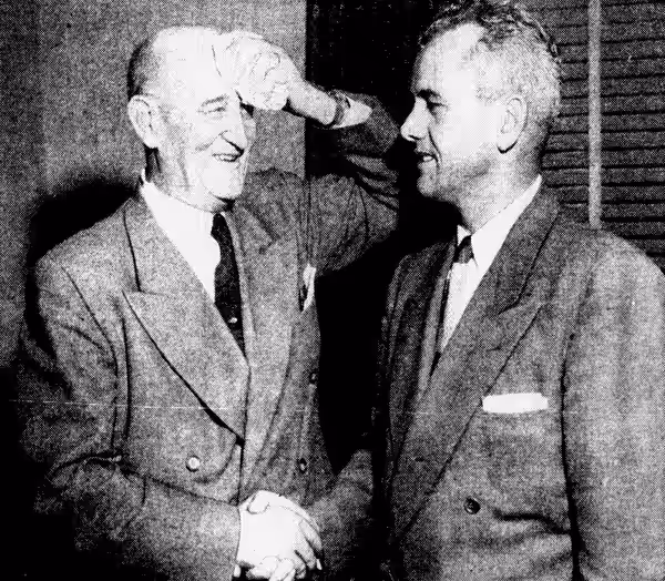 USC Trojans (left) athletic director Bill Hunter congratulates new head football coach Jess Hill (right) (1951)