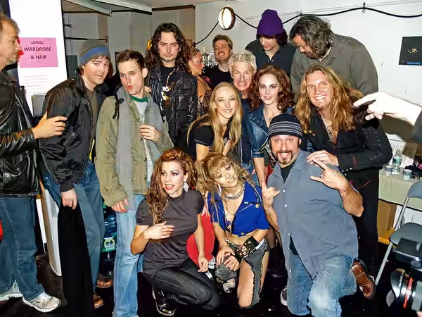 Constantine Maroulis, Kelli Barrett and the 2008 cast of off-Broadway musical Rock of Ages pose backstage with Kevin Cronin.