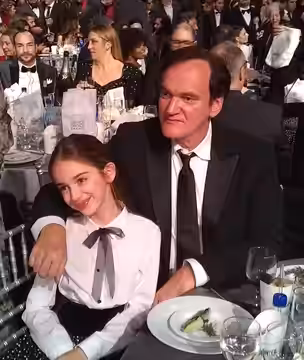 The “Once Upon a Time… in Hollywood” table with director Quentin Tarantino and young actress Julia Butters mugging for the camera during a commercial break in t (2020)