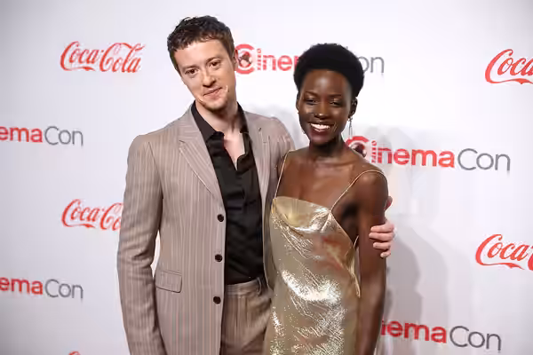 Joseph Quinn and Lupita Nyong'o on the red carpet at the Big Screen Achievement Awards at the 2024 CinemaCon at The Colosseum Theater at Caesars Palace in Las V