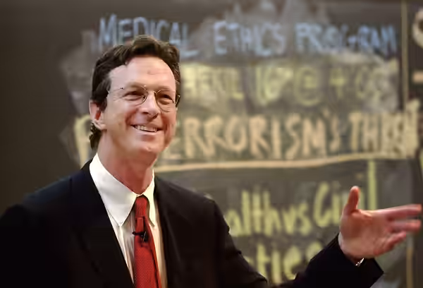 American author and speaker Michael Crichton speaking at Harvard. (2002)
