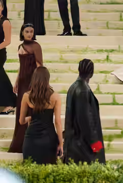 Damson Idris and a woman at the 2026 Met Gala, wearing fashion in theme of "Costume Art"