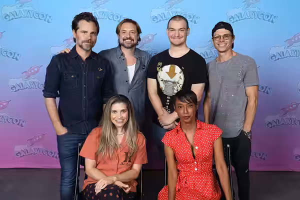Boy Meets World cast members, Will Friedle, Rider Strong, Matthew Lawrence, Danielle Fishel, and Trina McGee, take a photo with a fan at GalaxyCon at Raleigh in (2023)