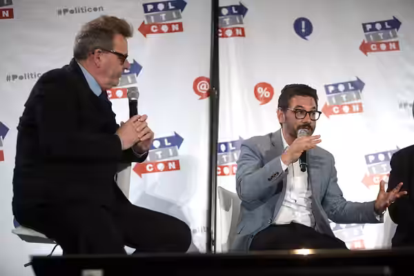 Greg Proops and Al Madrigal speaking at the 2016 Politicon at the Pasadena Convention Center in Pasadena, California. Please attribute to Gage Skidmore if used 