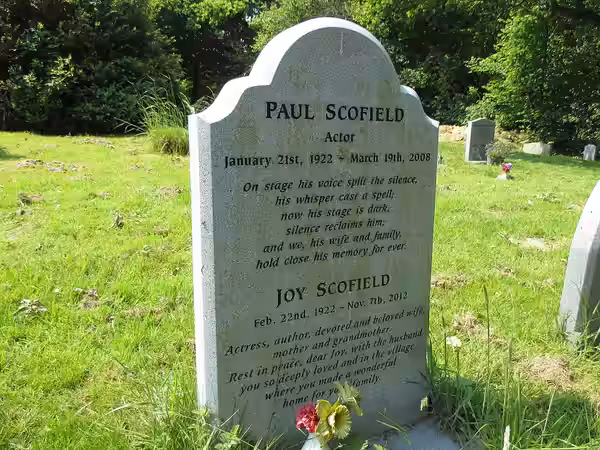 The gravestone of the actor Paul Scofield and his wife Joy in St. Mary's churchyard, Balcombe, West Sussex. (2016)